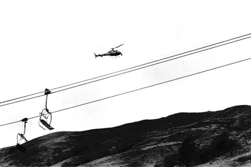 Figure 1. A television helicopter hovers over the course of the 2019 Tour de France in Les Menieures, the Alps (source: author’s photo).