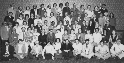 Figure 26. The group photograph taken at the Penrose Conference on Modern and Fossil Dinoflagellates held at Colorado Springs, Colorado, in April 1978. Bill Evitt is seated in the second row from the front, and is the fourth person from the left. He is sporting a ‘Stanford Palynology’ t-shirt with the famous SEM image of Peridinium limbatum, and is flanked by co-organiser Karen Steidinger on his right and Lois Elms on his left. Lew Stover, the other main proponent of the meeting, is sixth from the left on the same row and is clearly enjoying a joke with Lucy Edwards to his left. The names of all participants were given in Head & Harland (Citation2013, p. 4). The image was supplied by Martin Head, and is reproduced with permission.