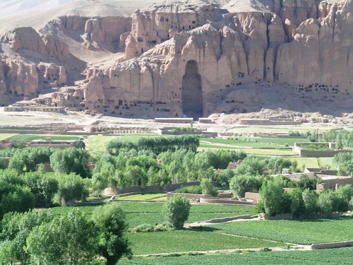 Figure 1. A continuously evolving landscape. View of the Bamiyan Valley with one of the destroyed Buddha statues in 2005. Photograph by Tracy Hunter. Reproduced unchanged according to CC BY-SA 2.0. Source: https://www.flickr.com/photos/11121785@N00/1778632003.