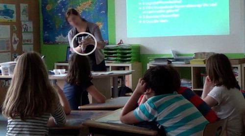 Figure 4. Teacher explaining that the water filter has three layers.