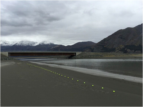 Figure 9. ‘Bridge Flow’ – line along the reduced Slims River at Kluane Lake. The art installation's metaphoric boundary line symbolically delineates the border of the vanished river. Art image © 2016 K.A. Colorado.