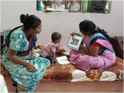 Figure 3. The GMCD Flipchart for individualized developmental recommendations and illustrative local photos in use by a rural frontline worker in India.
