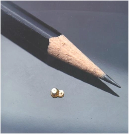 Figure 2 The fluocinolone acetonide (Retisert™) sustained-release intravitreal implant, shown relative to the tip of a pencil.