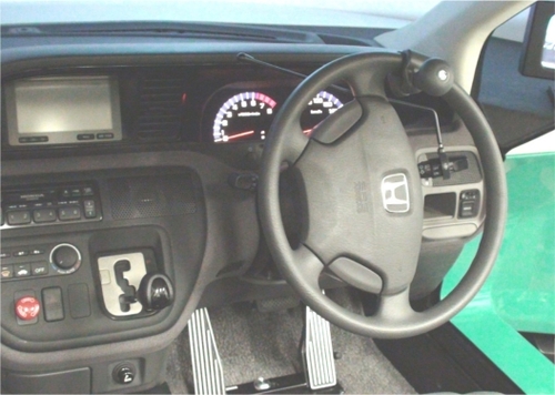 Figure 1 Modified driving simulator enabling patients with right or left hemiplegia to drive.