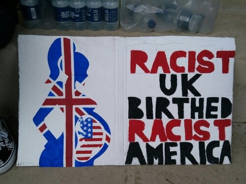 Figure 5. A protest sign illustrating a silhouette of a pregnant woman superimposed with a British flag. In her womb, there is a silhouette of a fetus, superimposed with an American Flag. The sign reads ‘RACIST UK BIRTHED RACIST AMERICA’.