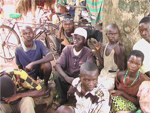 Figure 1.  An HIV positive man (wearing a white cap) discussing his disease.