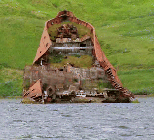 Figure 2.  Unalaska/Dutch Harbor crab pots stored in 2002 on the rusted hull of the SS Northwestern, bombed by Japanese during World War II.