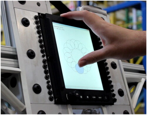 Figure 8. The MCDU screen was held from the top, in the supported condition, due to the shape of the frame.