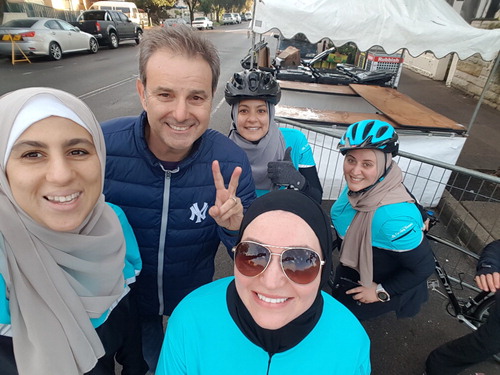 Figure 3. Australian sports media personality Tomilaris with members of the cycling sisters