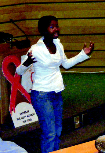 Fig. 2. Learner performing a self-composed poem about gender inequalities at seminar. Photograph by author.