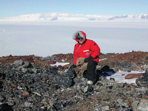 Figure 2. Thomas N. Taylor collecting permineralized Permian chert from the Skaar Ridge locality, Beardmore Glacier area, central Transantarctic Mountains, Antarctica, 2003.