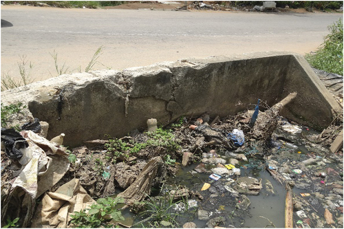 Figure 9. Blockage of rain sewer in M’Pouto (Abidjan, Cocody-Riviera) (Ouattara et al., Citation2021).