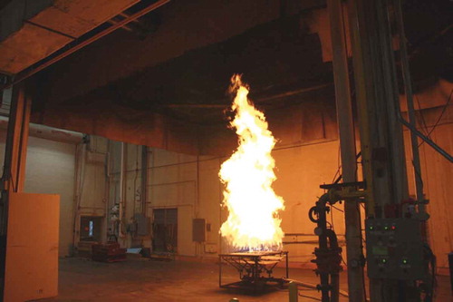 Figure 1. Photograph of the natural gas burner operating at a heat release of 8 MW. The 1.2-m-wide nonpremixed tube burner can deliver controlled fires from 0.1 to 8 MW.