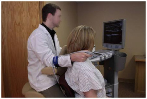 Figure 14 Carotid or thyroid exam performed with patient seated and scanning arm supported.