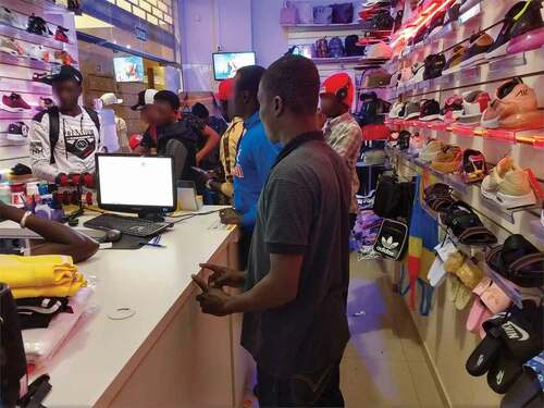 Figure 1. Haitian migrants sending remittances in the shop, Caxias do Sul, April 2019 © The authors