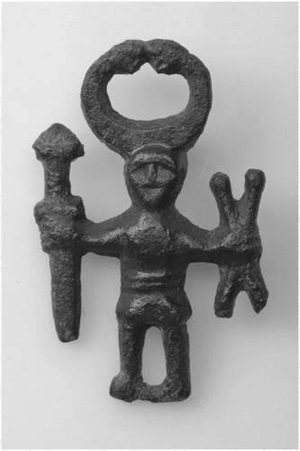 Figure 5. The Swedish Kungsängen figurine (800–1050 AD). This figurine portrays the Norse god Odin wearing a helmet with attached horns, terminating in bird beaks. These features have been interpreted as eagle beaks, alluding to the importance of the animal as a form often selected by Odin for shapeshifting. (Denstoredansk Citation2018)