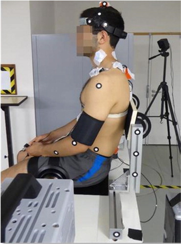 Figure 1. Frontal acceleration sled configuration with a seated volunteer.