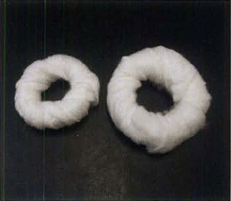 Figure 8. ‘Doughnuts’ can be used to protect vulnerable areas – such as hocks, elbow, stopper pads – from pressure sores. They are quickly and easily made by wrapping padding around the fingers, then folding the padding inside and round the circle made. They can be made to any size
