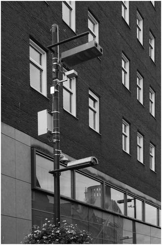 Figure 8 Pole with MAC adressess-trackers, cameras, microphones and the famed adjustable lights on Eindhoven’s Stratumseind. © Justin Agyin, 2019. As part of the Stratumseind living lab, twenty-two black boxes with three strips of LEDs have been distributed over its bar street. The light could be adjusted from a central control room, located in the nearby former courthouse. In addition, the data from the Wi-Fi-trackers, cameras and microphones embedded in these boxes can also be monitored and analyzed in real-time from that control room.