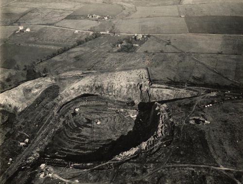 Figure 2. Limestone quarry on the edge of the Lehigh Valley illustrates the scale of cement manufacturing operations and its impacts on nearby residences, ca. 1920s. (Courtesy of Thomas Edison National Historic Site.)