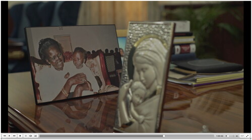 Figure 4 A framed photograph of Rebecca holding her daughter. (Screen freeze-frame from No Simple Way Home). Accessed from Afri Docs’ (@AfriDocs)—https://youtu.be/90m7gpKKnqU