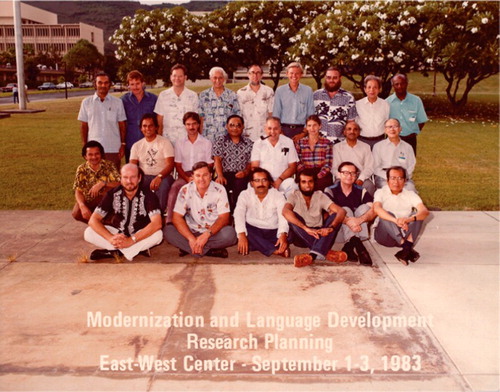 Figure 1. A photo from a collection of Björn Jernudd. Research-planning meeting convened in 1983 by Björn Jernudd as a part of the project he directed at the East West Centre, Honolulu on Modernisation and Language Development. Back row from left: Francis Mangubhai, Terry Crowley, Richard B. Baldauf, John DeFrancis, Paul Brennan, Björn Jernudd, John Lynch, Hoang Tue, E. Annamalai. Mid row from left: Patrick Hohepa (kneeling), Robert Underwood, David Cressy, Anton Moeliono, Robert B. Kaplan, Bobbie Nelson, D. P. Pattanayak, Zhou Youguang. Front row from left: Robert Gibson, Gregory Trifonovitch, Monsur Musa, Jayadeva Uyangoda, Jiří V. Neustupný, Bonifacio P. Sibayan. Not present: Donald M. Topping, John Kwock-Ping Tse and Jyotirindra Dasgupta.