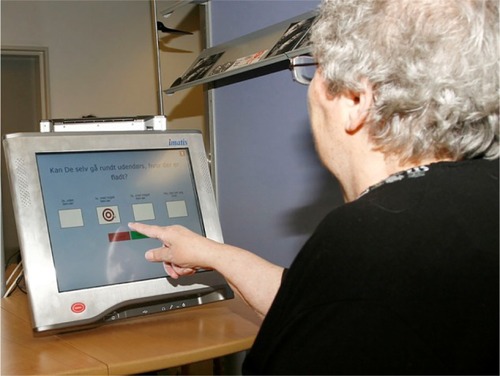 Figure 1 A patient using the touch screen.