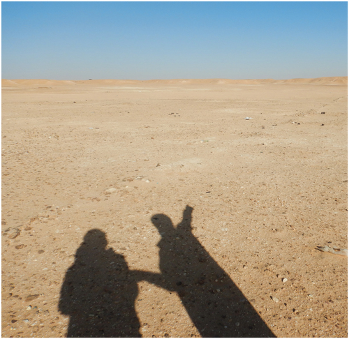 Figure 4. Photography taken during a visit to the site of Ed Jal, a former refugee camp abandoned at the beginning of the 1980s after a flood that carried the river bed away. The right shadow is Lahsen’s, and the left one is mine. March 2020. Photograph by the author.