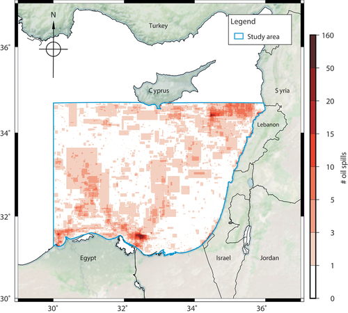 Figure 2. Visualization of study area with heat map of the amount of oil spills collected inside. The blue outline marks the study area. The red color map shows numbers of oil spills collected and manually annotated in this study from 2015 to 2018; see subsection 2.2 for detailed descriptions of manual inspection. Note that the oil spills were annotated with rectangular bounding boxes showing their extent, which are not exact polygons showing the oil spill positions. The basemap was obtained from Stevens (Citation2020).