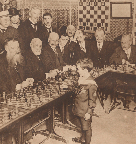 Figure 2. Samuel Reshevsky, eight years old, during his first simultaneous exhibition at the Café de la Rotonde in Paris, 15 May 1920. Published in Le Miroir, 23 May 1920. Courtesy of Gallica/Bibliothèque Nationale de France.