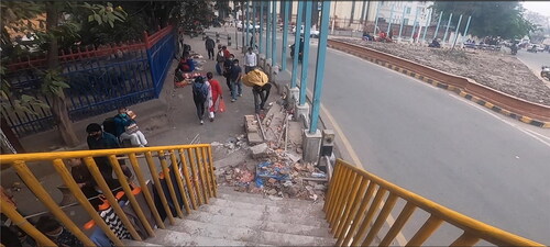 Figure 1. Construction materials piled up on the pavement blocking the stairs—an excerpt taken from the video of P4, vision-impaired.