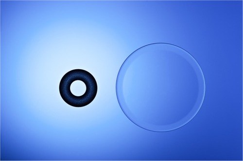 Figure 1 The size of the KAMRA inlay compared to a 14 mm diameter soft contact lens.