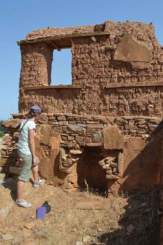 Figure 4. Typical vernacular mudbrick architecture where mudbrick is laid across stone foundations and wood beams provide support; please note areas where original plaster surfaces are preserved, Eski Hacıveliler.