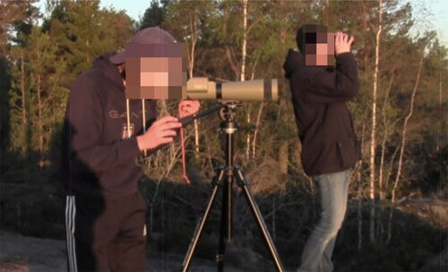 Figure 1. Herman, Anders, and binoculars tuning in to the grouse.
