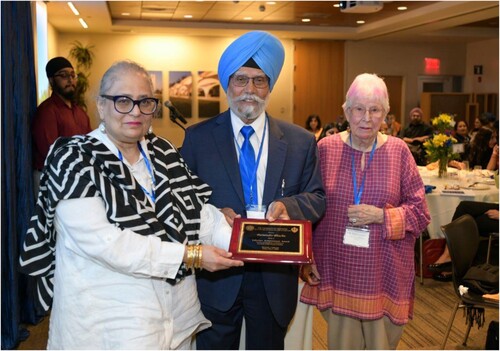 Figure 2. Parminder Bhachu receiving her Lifetime Achievement Award for her contribution to the field of Sikh Diaspora Studies from Karen Leonard and Pashaura Singh.