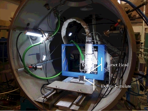 Figure 7. View of DELIA ∅1.38-m test section with vertical laser head and inactive fuel debris simulant.