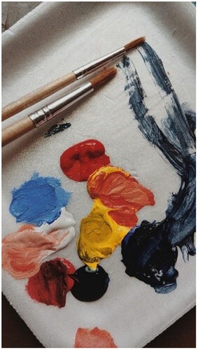 Figure 2. Mixing different colours of paint on a palette. Photo by Andres Perez on Unsplash.