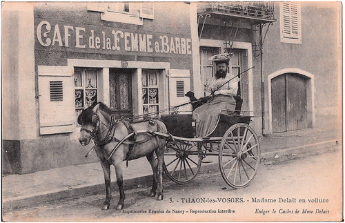 Figure 6. Clémentine Delait Clattaux (1865–1934) in a horse-drawn buggy in front of her Café de la Femme à Barbe (The bearded woman’s pub) in Thaon-les-Vosges. (Postcard from the collection of W.W. de Herder).