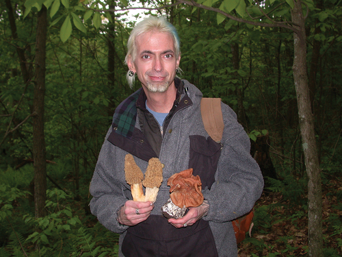 Figure 1. Tom displaying two of his favorite “mushroom” genera, Morchella and Gyromitra (morels and false morels), May, 2011. Photograph by Dan Lindner.