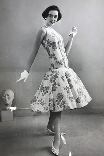 Figure 4 Luis Estévez, day dress, December 30, 1957. Press photograph. ISU Textiles and Clothing Museum, 2022.7.7. <https://tcm.catalogaccess.com/objects/11334>