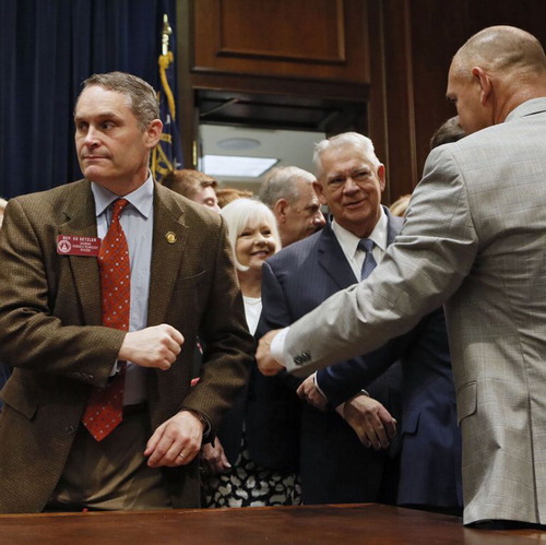 Figure 1. Georgia State Representative Ed Setzler, a sponsor of HB 481 receives a fist bump after passage of the bill. Photo credit: Bob Andres/AJC.com