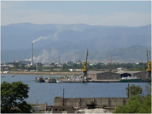 FIGURE 2. Smoke coming from chimneys, suggesting industrial activity; harbour of Chongjin, capital of North Hamgyong.