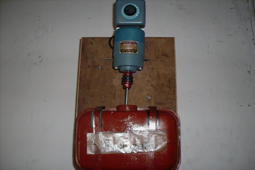 Figure 2 Fuel tank with mechanical stirrer and its position in the set-up.