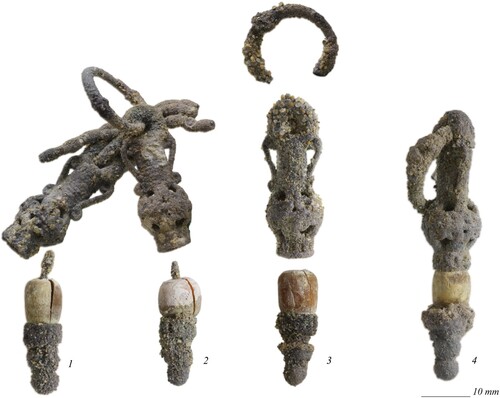 Figure 10. Silver and coral earrings from Tomb N1-3: 1) earring BE21-144-014-027_F473; 2) earring BE21-144-014-033_F631; 3) earring BE21-144-014-028_F572; 4) earring BE21-144-014-033_F606 (photographs by J. Then-Obłuska and the Berenike Project).