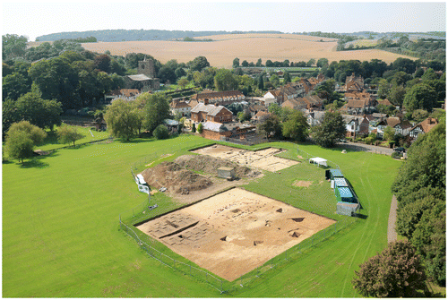 Fig 3 Lyminge, showing the pre-Christian royal focus under excavation in the foreground overlooked (upper left) by the site of the Anglo-Saxon monastery and later medieval church. Photograph by G Thomas © University of Reading.