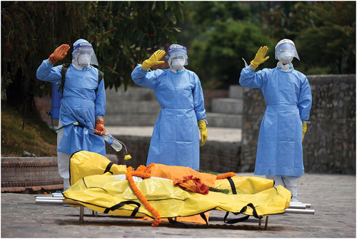 Figure 7. Nepal Army personnel performing their final ritual salute to the deceased during second pandemic wave. Photo by Angad Dhakal®, 2021.