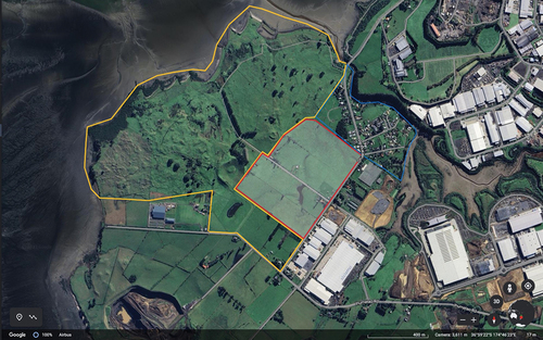 Figure 3. Ihumātao peninsula showing the Ōtuataua stonefields historic reserve (yellow), the ihumātao papakāinga (blue) and the contested block (red, shaded). Source: Google Earth, 36°59’22”S 174°46’23”E. Accessed August 8, 2023.