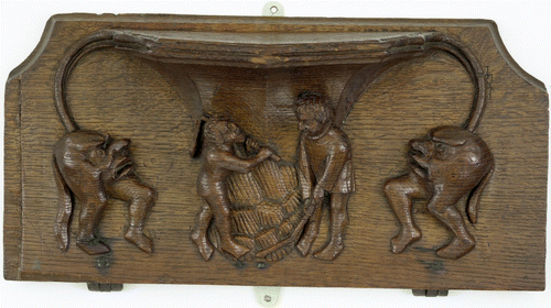 Figure 13.  Hidden misericord imagery on the bottom of a carved wooden church seat, King's Lynn, England, fourteenth century. Victoria and Albert Museum W.7-1921. Image: © Victoria and Albert Museum.