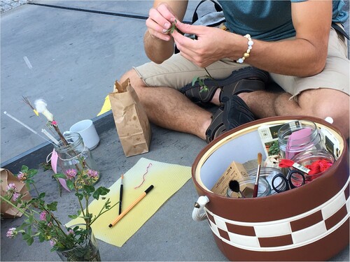 Figure 5. The poster with red clover and the making of hand pollination tools on the dock. Photo by Åsa Ståhl.