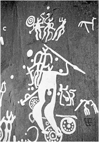Figure 15. The panel found at Hede, Kville, on which this case study focuses. As shown, a large number of both horned and non-horned figures are depicted amongst several different forms of abstract imagery. The large amount of figures shown with weaponry, and what seems to be many shields and swords deposited throughout the scene, gives off an impression of battle (expanded on below) (Swedish Rock Art Research Archives 2019)